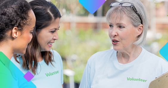 Three women volunteer talking